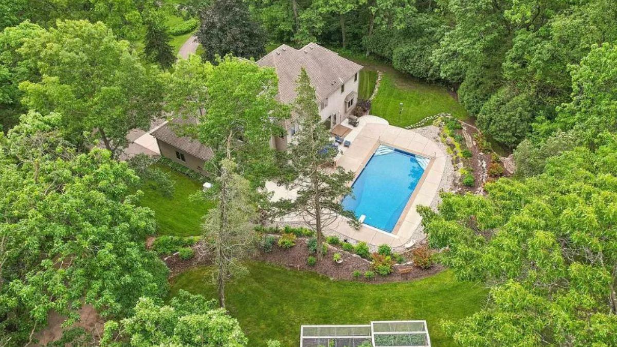 Tranquil Craftsman Retreat with Lush Landscaping and Poolside Bliss