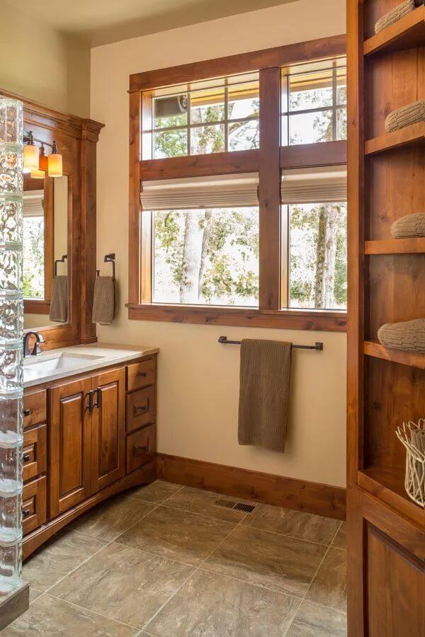 Craftsman Bathroom with Rich Wood Accents and Glass Block Details
