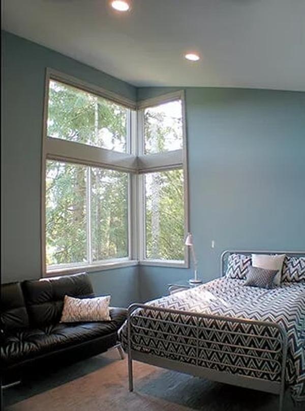 Relax in This Tranquil Bedroom with Expansive Windows