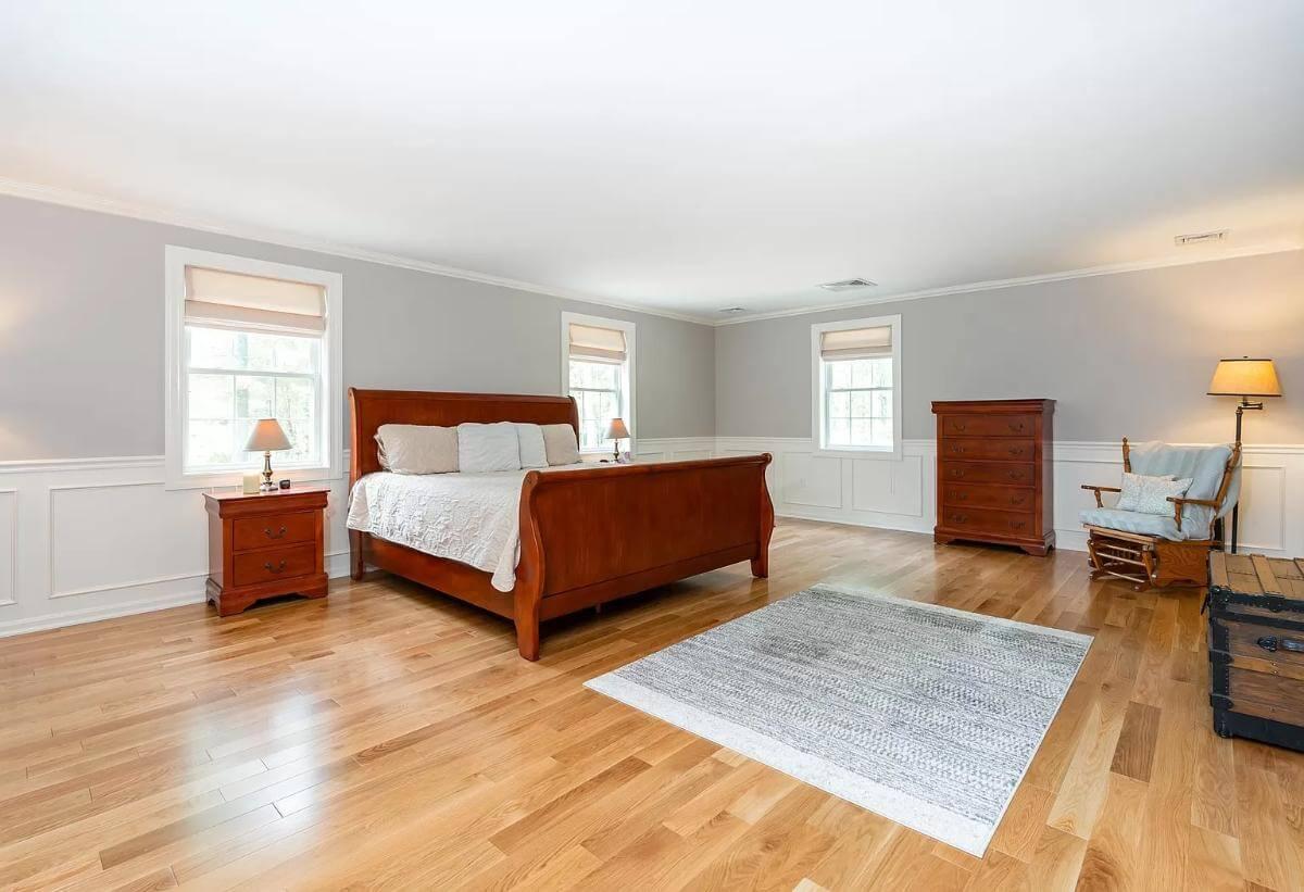 Classic Bedroom with Sleigh Bed and Wainscoting Elegance