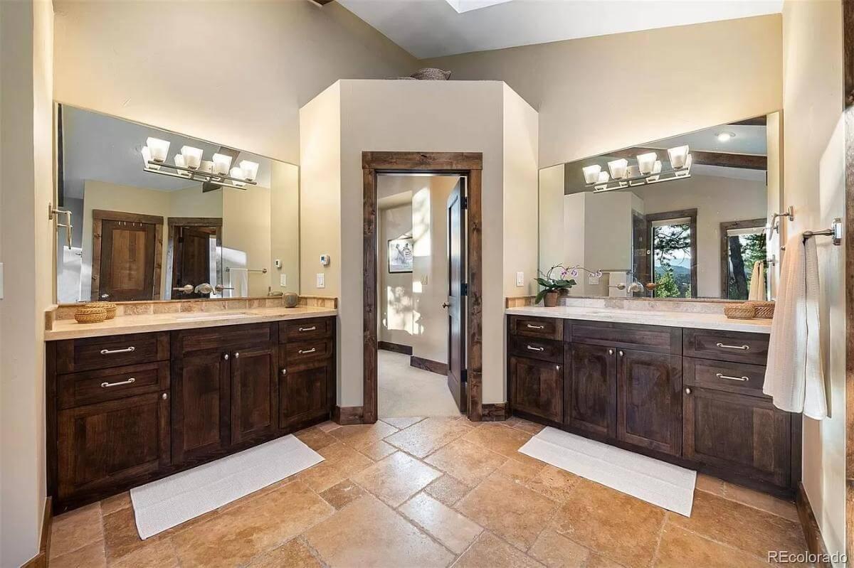 Dual Vanities and Graceful Stonework Highlight This Bathroom