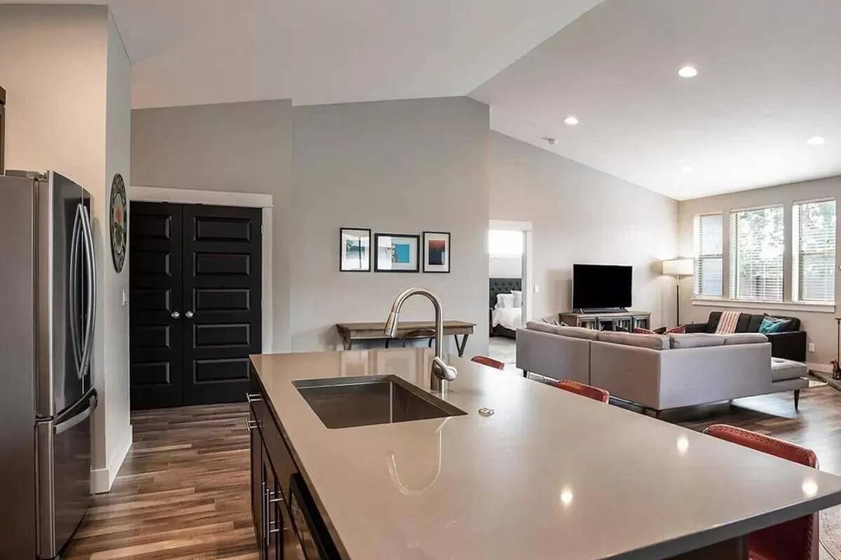 Efficient Use of Space with This Open-Concept Living Area and Kitchen Island