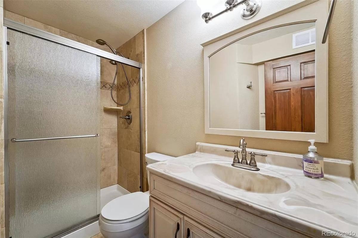 Cozy Bathroom with Elegant Marble-Topped Vanity