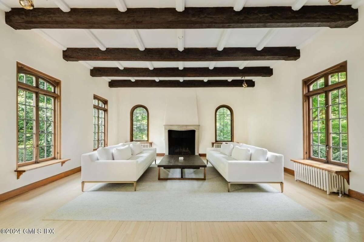 Discover the Sophisticated Beamed Ceiling in This Elegant Living Room