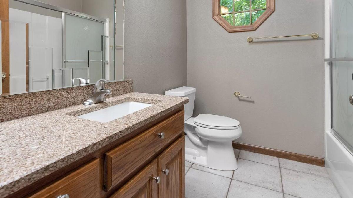 Bathroom with Octagonal Window Adding a Unique Touch