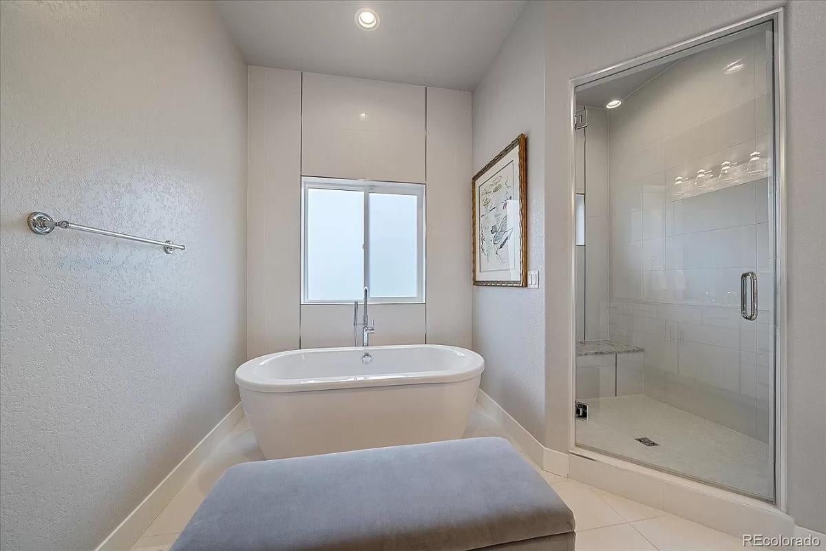 Take in the Serene Tub Nook and Spacious Shower