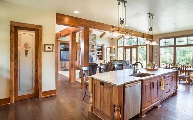 Check Out the Spacious Island and Rich Wood Details in This Craftsman Kitchen