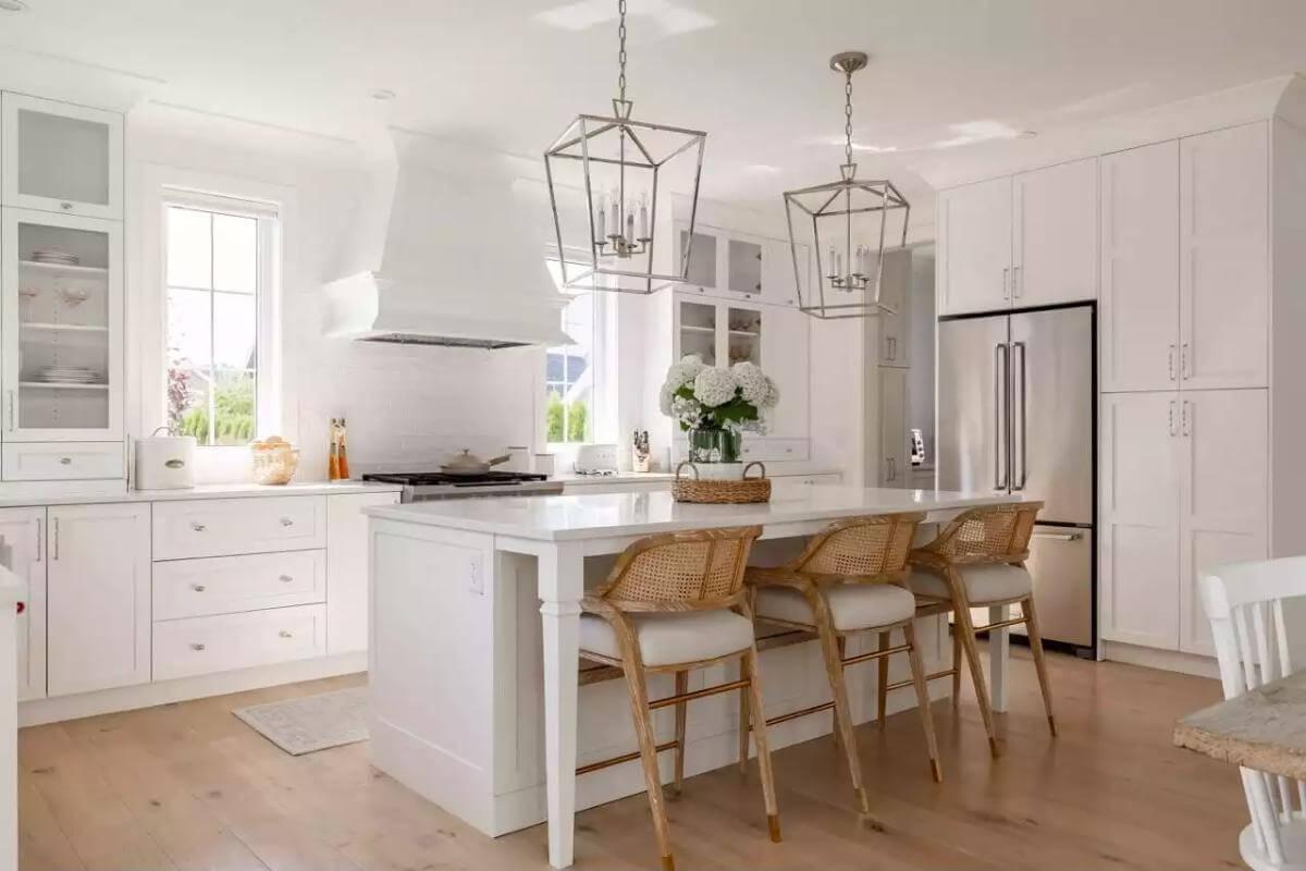 Admire the Symmetrical Lantern Pendants in This Crisp White Kitchen
