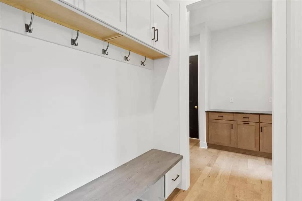 Efficient Mudroom with Handy Hooks and Bench Storage