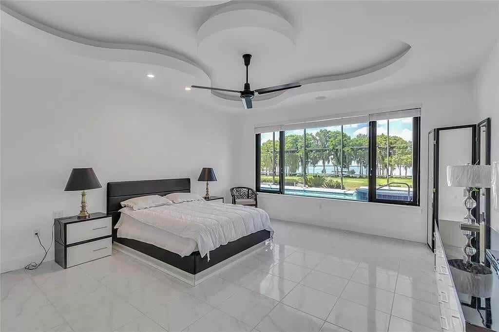 Look at the Curved Ceiling in This Sleek Bedroom with Lake Views