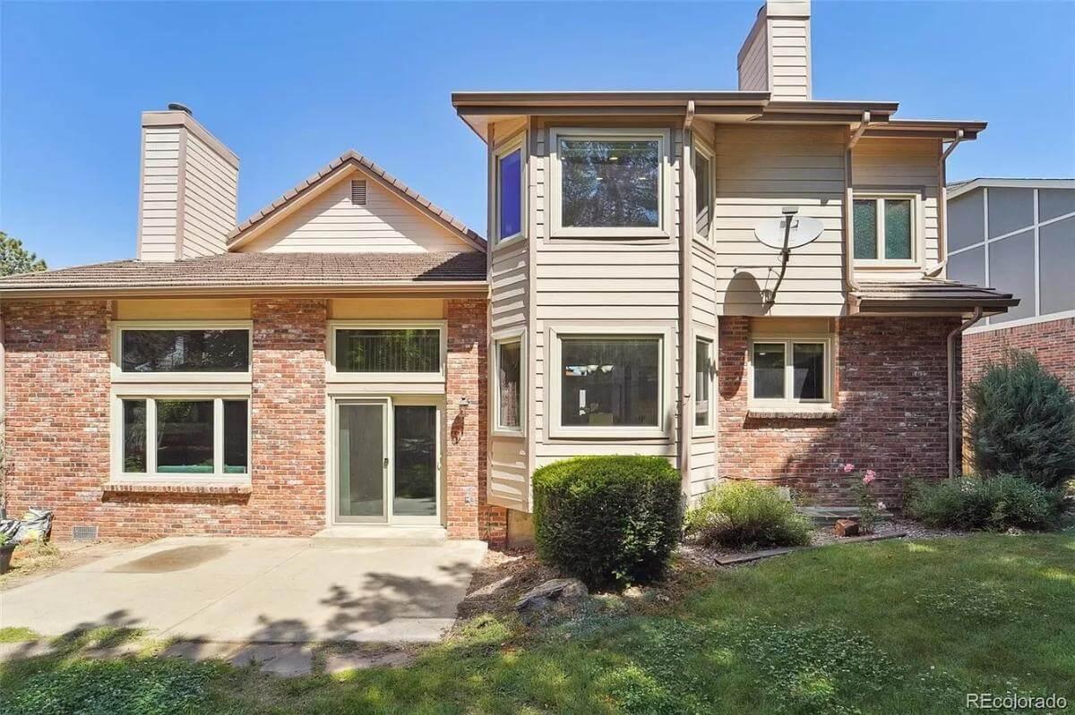 Charming Brick and Siding Exterior with Bay Windows
