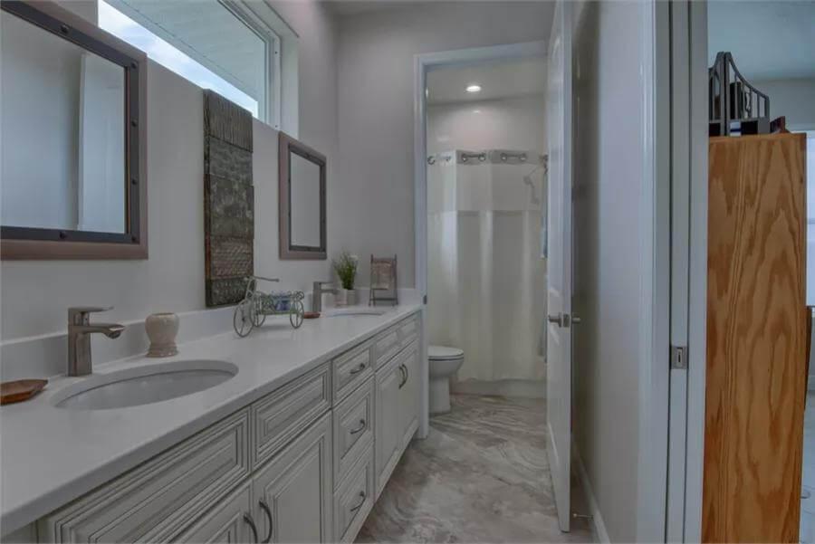 See the Practical Layout with Dual Mirrors in This Bright Bathroom