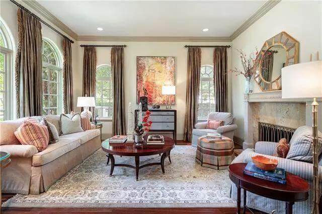 Sophisticated Living Room with Classic Artwork and Fireplace