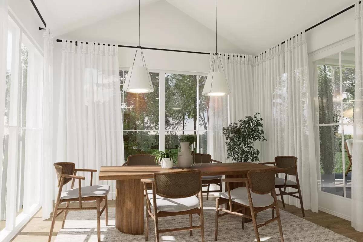 Natural Light Fills This Minimalist Dining Room with Sleek Pendants