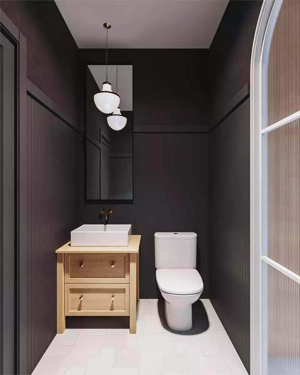 Notice the Dark Paneling and Bright Vanity Combo in This Chic Powder Room