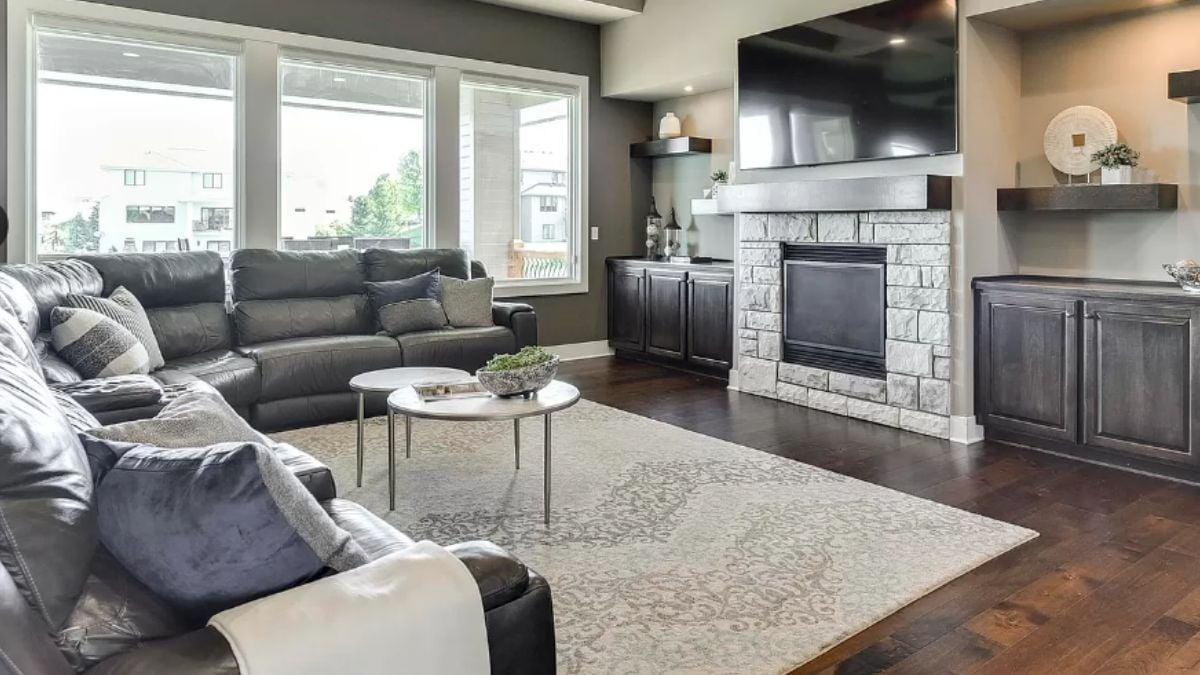 Cozy Living Room with a Stone Fireplace Centerpiece