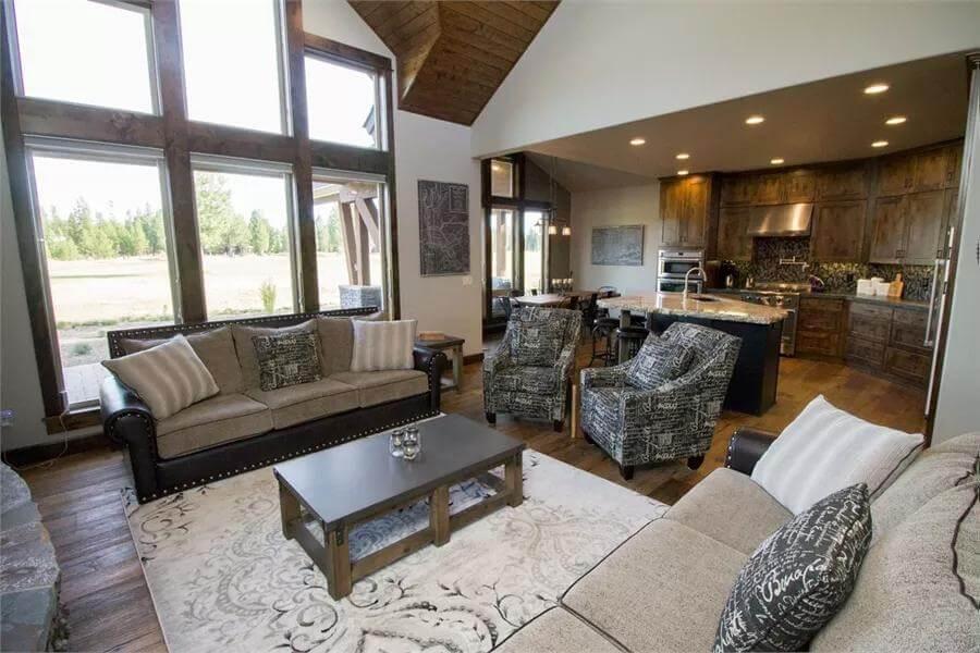 Living Room with Vaulted Ceilings and a View into the Cozy Kitchen