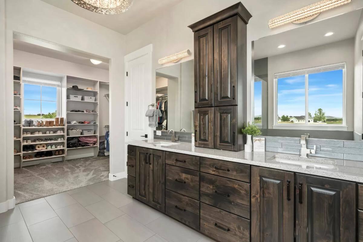 Stunning Bathroom with a Walkthrough Closet and Earthy Cabinets