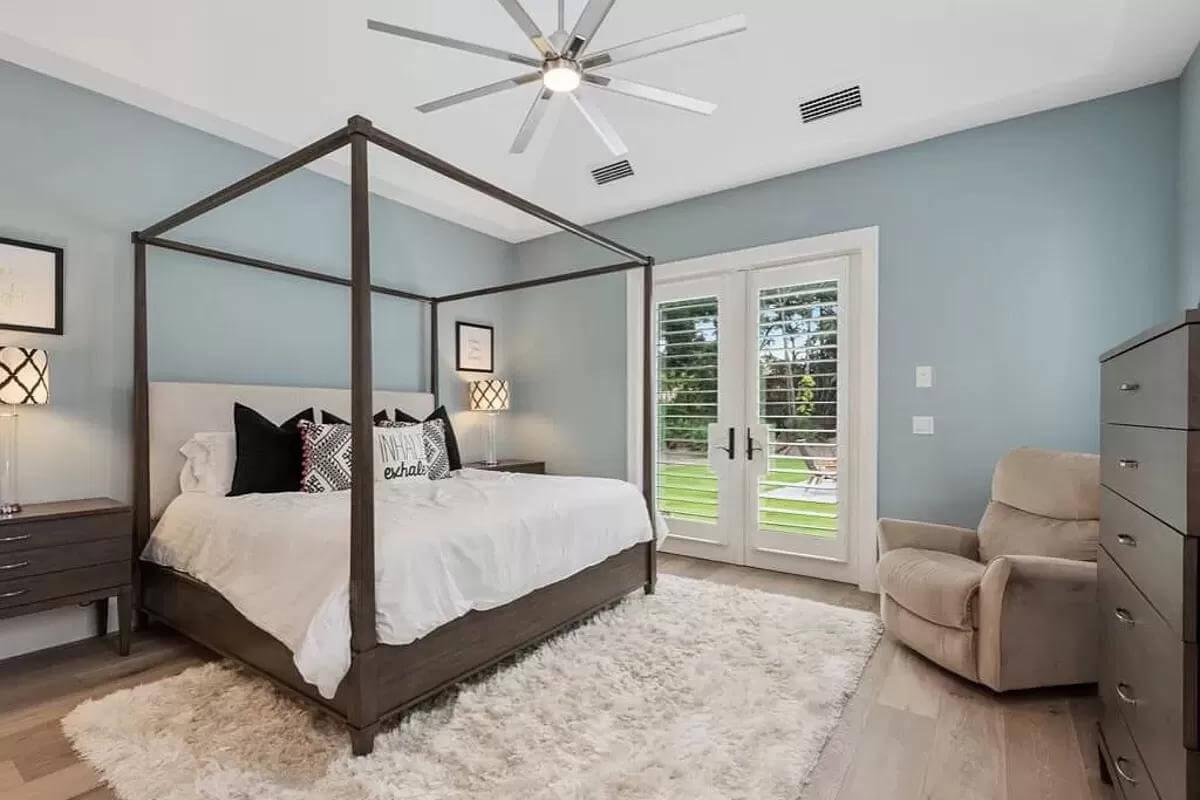 Relax in This Spacious Bedroom with a Four-Poster Bed