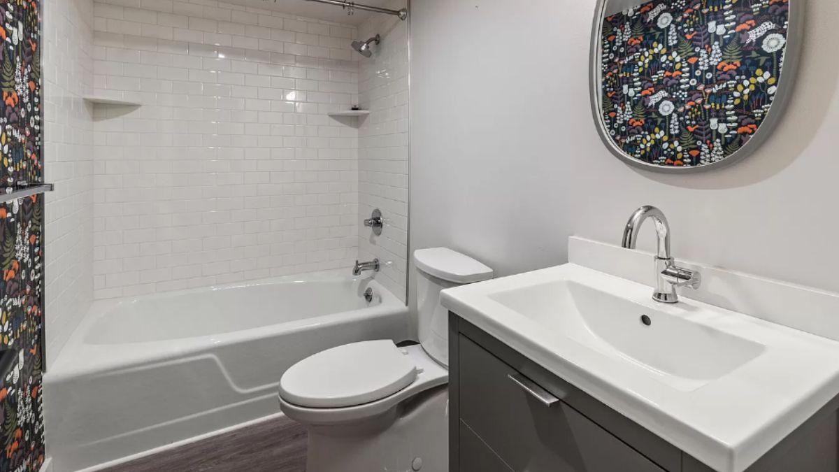 Spot the Playful Shower Curtain in This Clean Bathroom Design