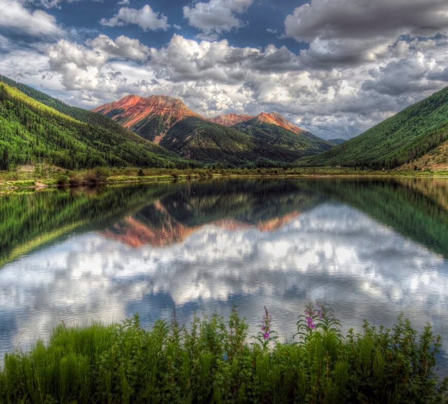 The current image has no alternative text. The file name is: Red_Mountain_reflected_in_Crystal_Lake_10_miles_south_of_Ouray_Colorado.jpg