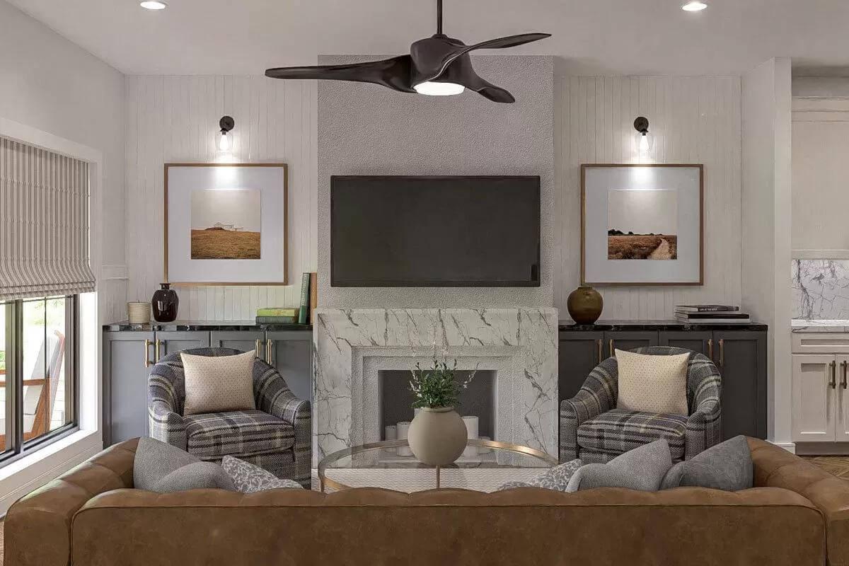 Warm Family Room with Marble Fireplace and Modern Ceiling Fan
