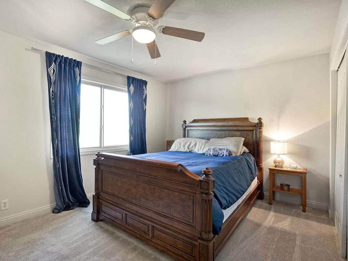 Classic Bedroom with Rich Wooden Bedframe and Subtle Elegance
