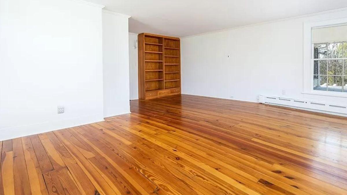Spacious Room with Warm Hardwood Floors and Built-In Bookshelves