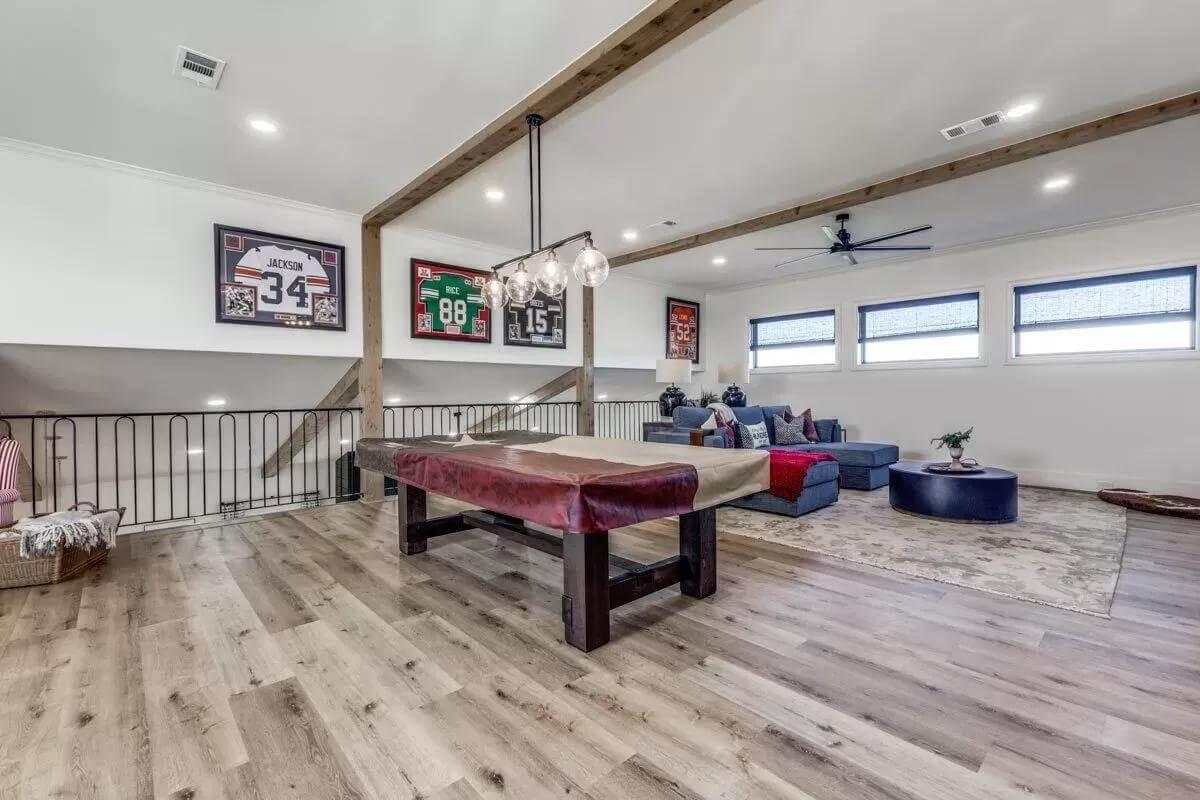 Check Out This Loft with Sports Memorabilia and Game Table