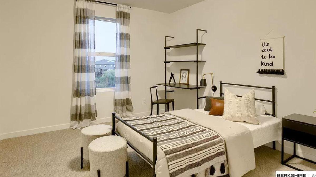 Simple and Stylish: This Bedroom Features a Metal Bed Frame and Textured Decor