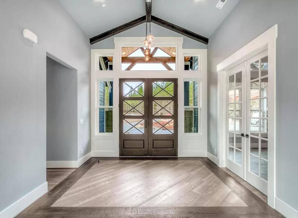 Admire the Craftsman Entryway with Striking Cross-Pane Doors