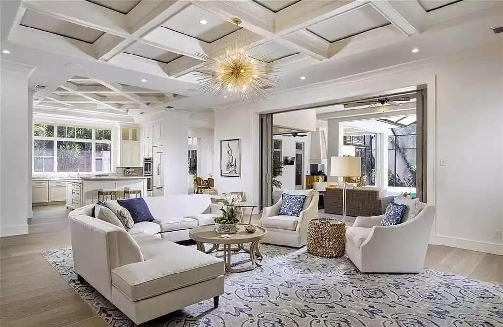 Spacious Great Room with Coffered Ceilings and Indoor-Outdoor Flow