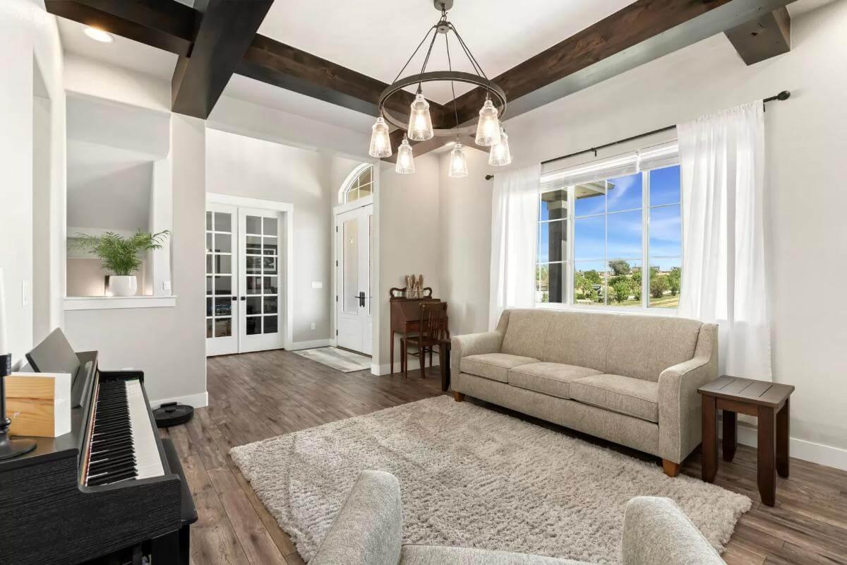 Welcoming Living Room with Dark Beamed Ceiling and Cozy Seating