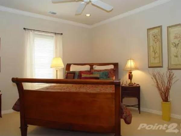Cozy Craftsman Bedroom with Sleigh Bed and Thoughtful Accents