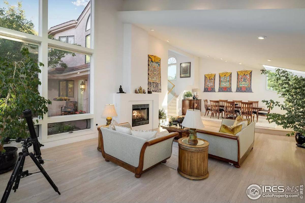 Open Living and Dining with Large Windows and Intriguing Art