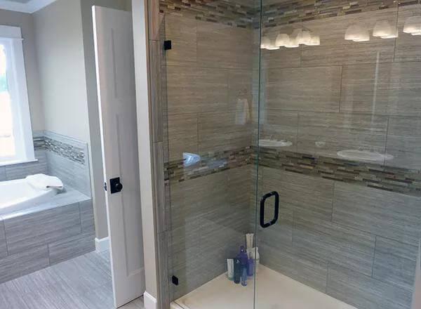 Notice the Sleek Shower Tiles in This Spacious Craftsman Bathroom