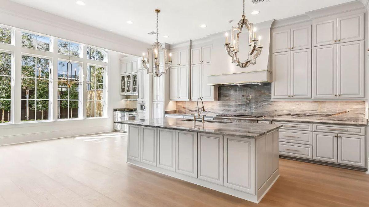Wow, Look at Those Elegant Chandeliers Highlighting This Expansive Kitchen
