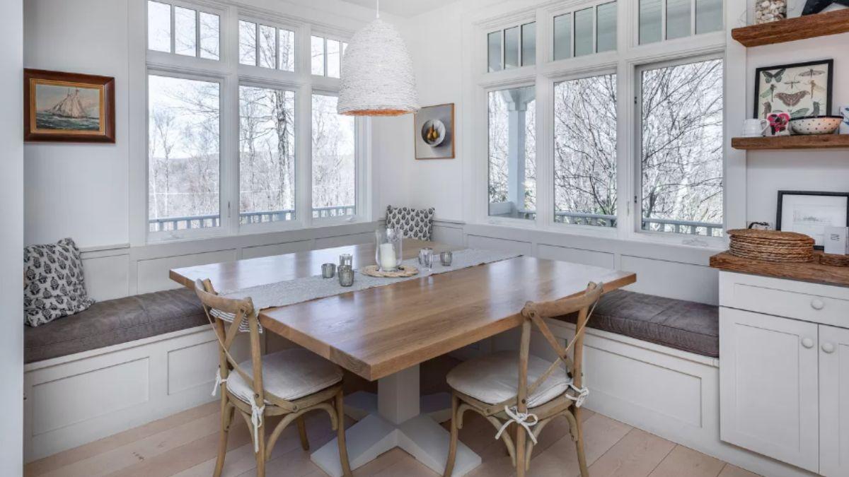 Cozy Breakfast Nook with Built-In Benches and Nature Views