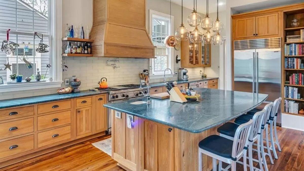 Wow, Check Out Those Hanging Glass Pendants in This Warm Kitchen