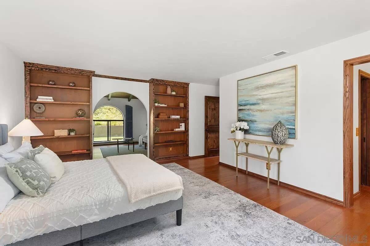 Notice the Rich Wooden Shelving in This Serene Bedroom Retreat