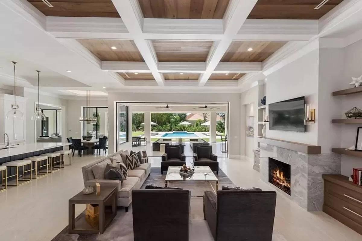 Get Cozy in This Chic Living Room with a Coffered Ceiling and Fireplace