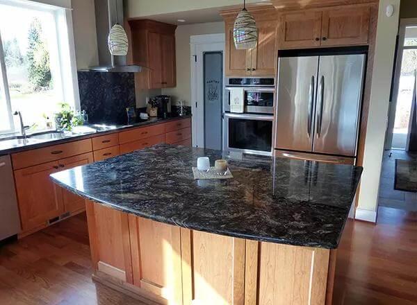 Spacious Craftsman Kitchen with Striking Granite Island