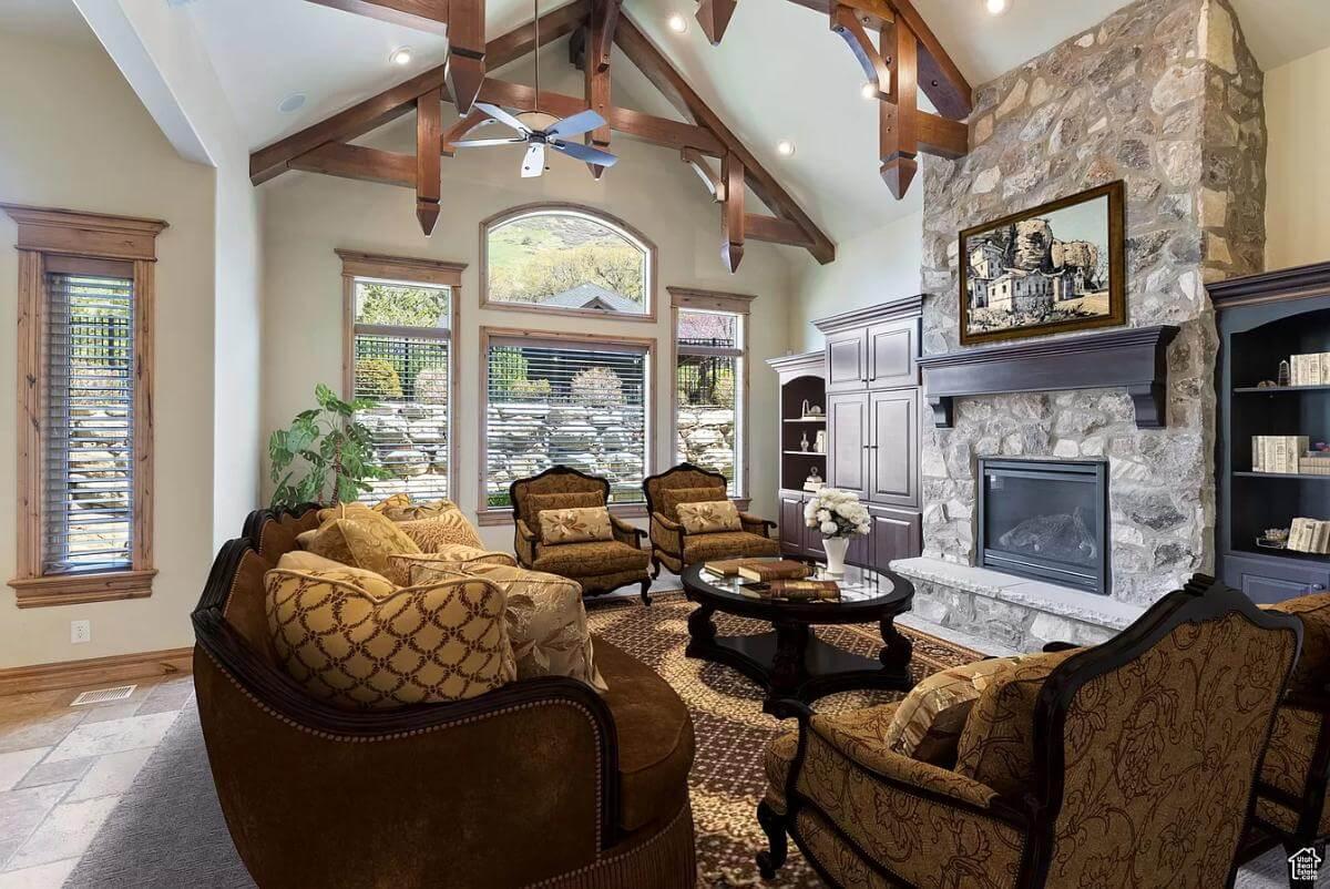 Appreciate the Timber Beams and Stone Fireplace in This Craftsman Living Room