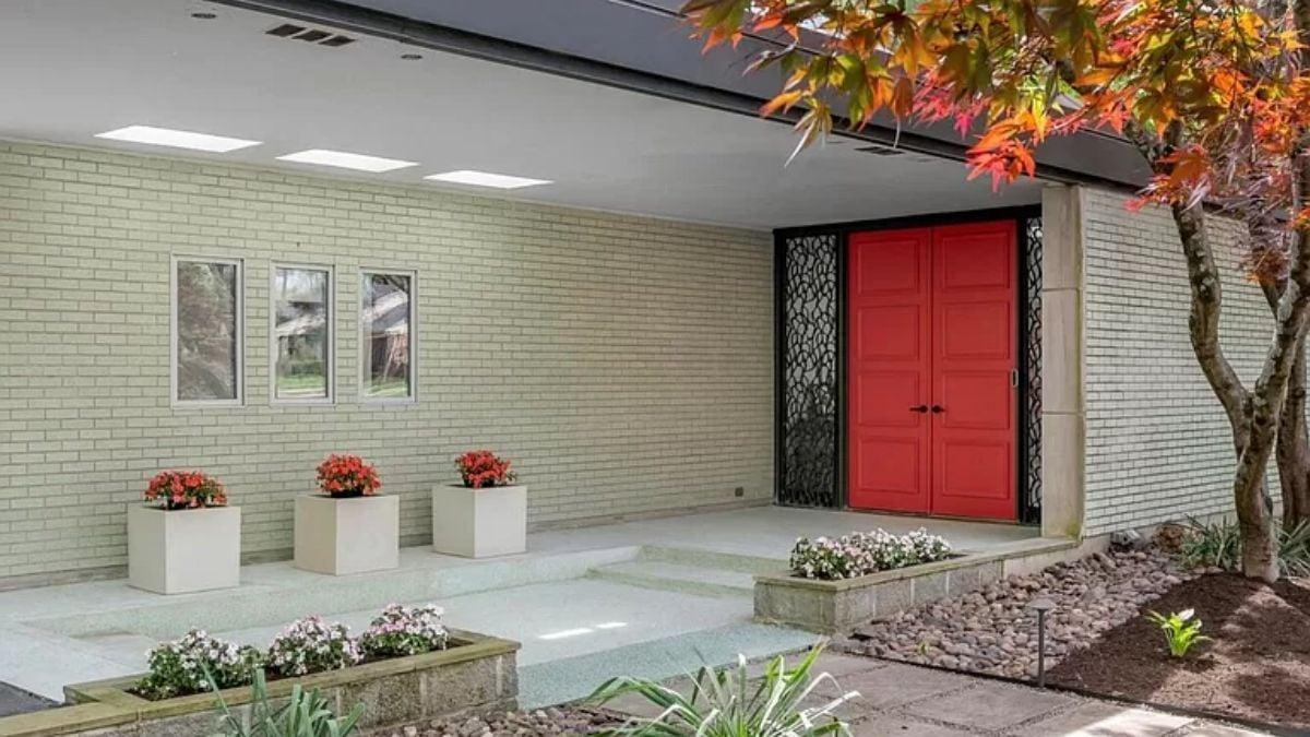 Check Out That Bold Red Door Against the Subdued Brick