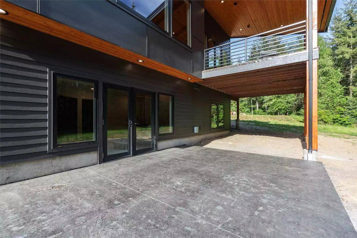 Step Out onto the Spacious Covered Patio with Forest Views