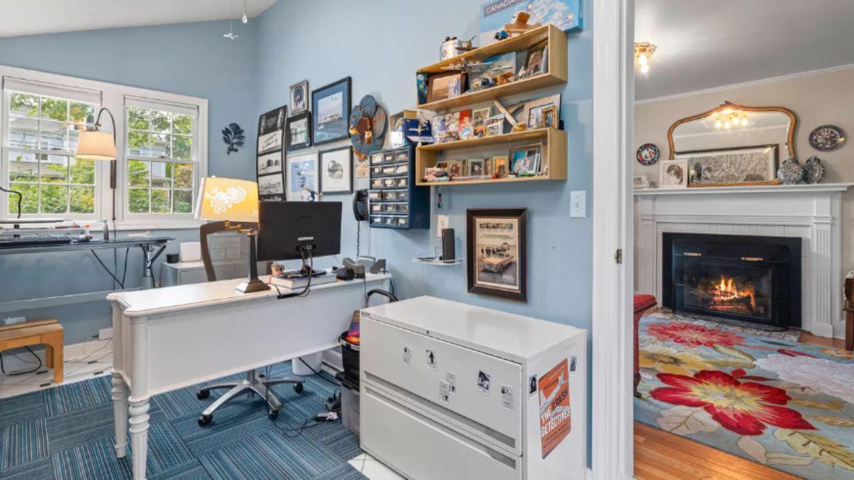 Functional Home Office with Gallery Wall and Fireplace Glimpse