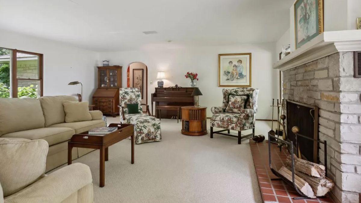 Classic Living Room with a Stone Fireplace and Floral Armchairs