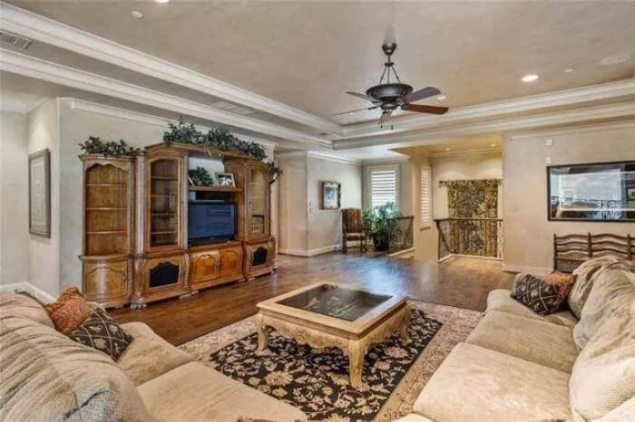 Relax in This Cozy Living Room with an Ornate Entertainment Center