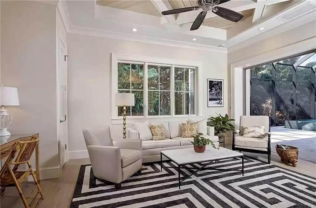 Relax Under the Intriguing Coffered Ceiling in This Open Living Space