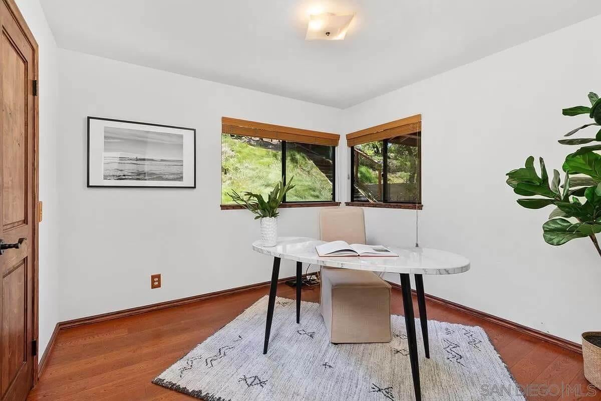 Embrace the Peace with Floor-to-Ceiling Views in This Home Office